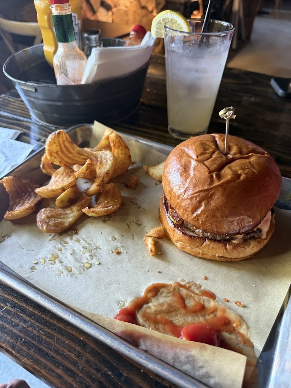 Menu board for burgers, fries, and sandwiches.